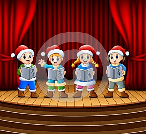 Cartoon children singing christmas carols on the stage