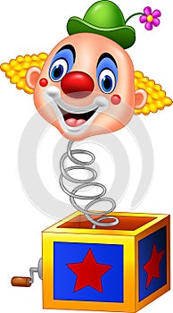 Cartoon clown head coming out of the box