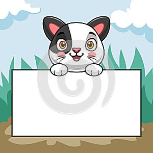 Cartoon cute kitten holding blank paper in isolation with beautiful scenery background
