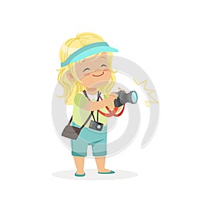 Cartoon flat preschool girl standing with digital photo camera in hands. Photographer or reporter profession concept