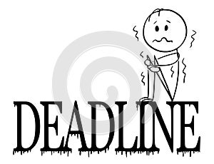 Cartoon of Depressed and Shaking Man or Businessman Sitting on Big Deadline Letters