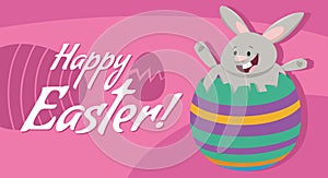 cartoon Easter bunny hatching from an egg greeting card