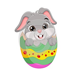 Cartoon Easter bunny inside a cracked Easter egg