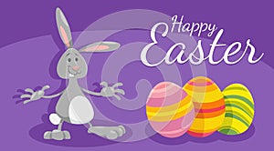 cartoon Easter bunny with painted eggs greeting card