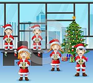 Cartoon of Group children in santa singing christmas carols