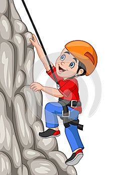Cartoon happy boy climbing rock photo