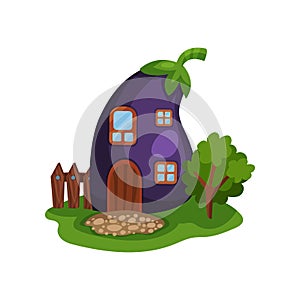 Cartoon illustration with fairy house in form of ripe purple eggplant, little wooden fence and tree on green meadow