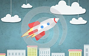 Cartoon illustration of rocket flying above city