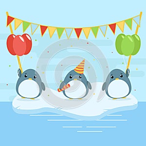 Cartoon illustration of three cute penguins with balloons and falgs on ice floe.