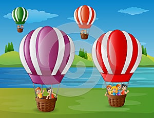 Cartoon kids flying in a hot air balloon at the riverbank