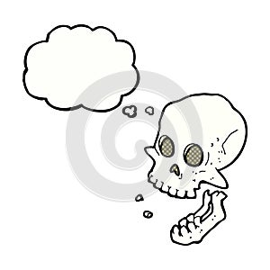 cartoon laughing skull with thought bubble