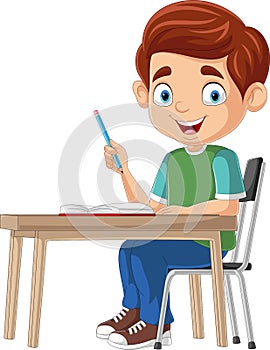 Cartoon little boy studying on the desk