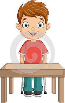 Cartoon little boy studying on the desk