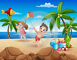 Cartoon of little children playing with kites on the beach photo