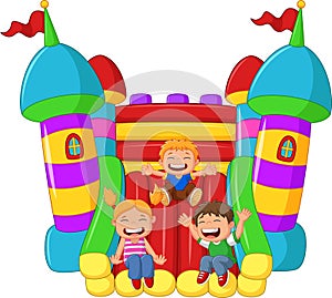 Cartoon little kid playing slide on the inflatable balloon