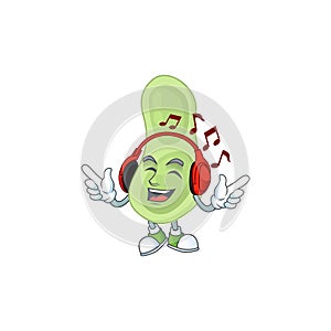 Cartoon mascot design staphylococcus pneumoniae enjoying music with headset