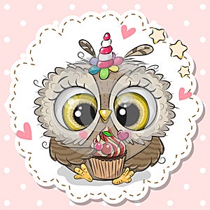 Cartoon Owl with the horn of a unicorn and a cupcake