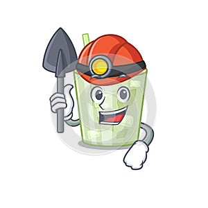 A cartoon picture of mojito lemon cocktail miner with tool and helmet