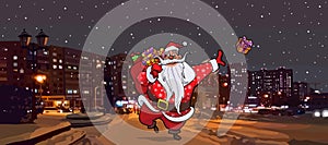 Cartoon Santa Claus with a bag of gifts walks through the winter city