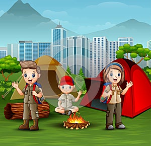 Cartoon scout boys and girl at campsite