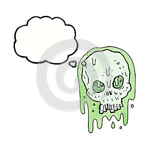 cartoon slimy skull with thought bubble