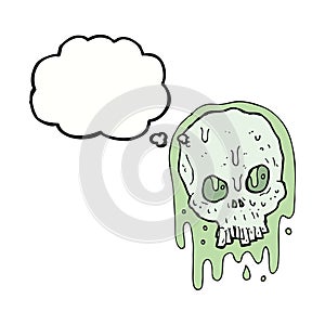 cartoon slimy skull with thought bubble