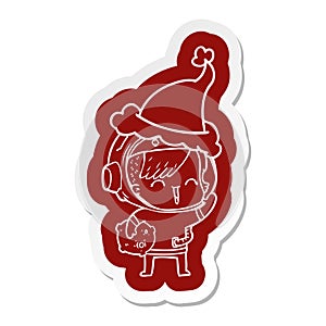 cartoon  sticker of a happy spacegirl holding moon rock wearing santa hat