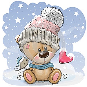 Cartoon Teddy bear in a knitted cap sits on a snow