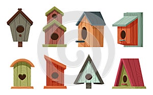 Cartoon wooden bird houses. Colorful isolated forest or garden bird feeders for cold season. Outdoor homes for animals