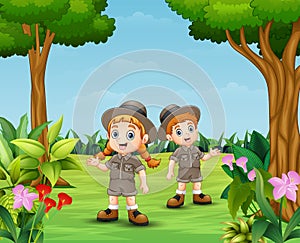 Cartoon of zookeeper boy and girl in the garden