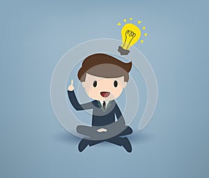 Cartooned Young Businessman with Bulb Overhead