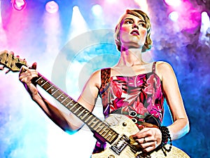 Cartoonize female rock guitarist on stage in concert