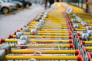 Carts for purchase at the store. red food basket trolleys photo