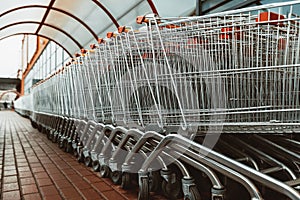 Carts for purchase at the store. red food basket trolleys photo