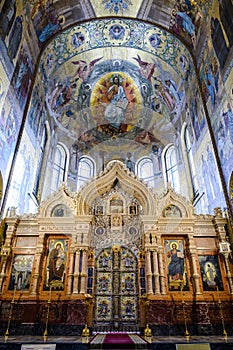 Carved altar ornament and dome decorated with frescoes in the Church of the Savior on Spilled Blood in St. Petersburg, Russia