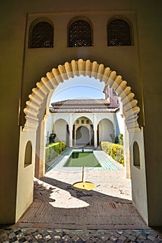 Carved arches of the interior of the Alcazaba arab castle in Malaga