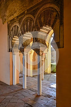 Carved arches of the interior of the Alcazaba arab castle in Malaga