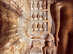 Carved architecture of India. Figurs of Jainism inside the 7th century cave temple, in town Badami, India