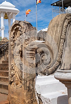 Carved balustrade and the guard stone in Thuparama temple entrance