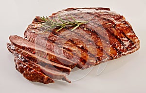 Carved barbecued medium-rare flank steak