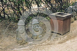 Carved bazalt Harubang statues is symbol of fertility in Korean culture.