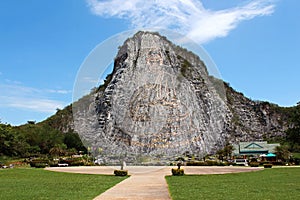 Carved buddha image on the cliff at Khao Chee Jan