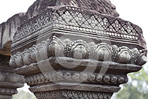 Carved column floral ornament - bas-relief of Angkor Wat complex temple, Siem Reap, Cambodia. Ancient khmer architecture