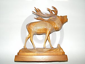 Carved deer on an oak pedestal