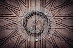 Carved door with lock on chain