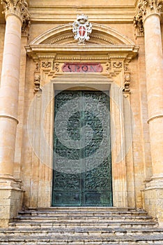 Carved door of Saint Nicholas of Myra Cathedral in Noto