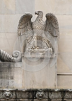 Carved eagle sculpture above entrance to the historic Federal Reserve Bank of Dallas building at 400 Akard Street in Texas.