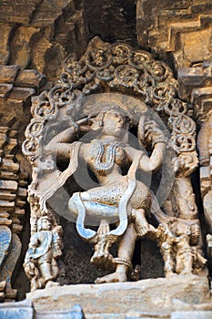 Carved figure of a Sundari, beautiful lady, looking in the mirror, Chennakeshava temple. Belur, Karnataka.