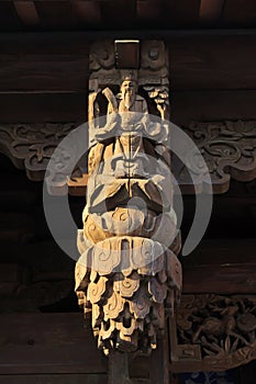 carved figures in front of the door