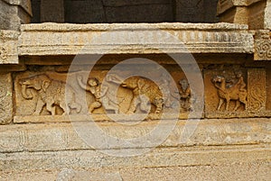 Carved figures on the plinth of the inner courtyard, cloisters or pillared verandah. Achyuta Raya temple, Hampi, Karnataka. Sacred